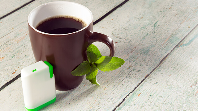 Box of stevia tablets and coffee